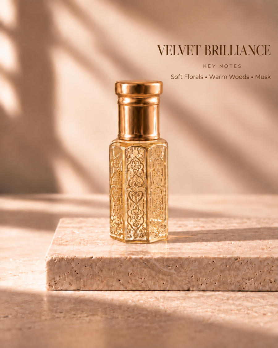 Velvet Brilliance gold oil rub bottle with key notes Soft Florals, Warm Woods, Musk