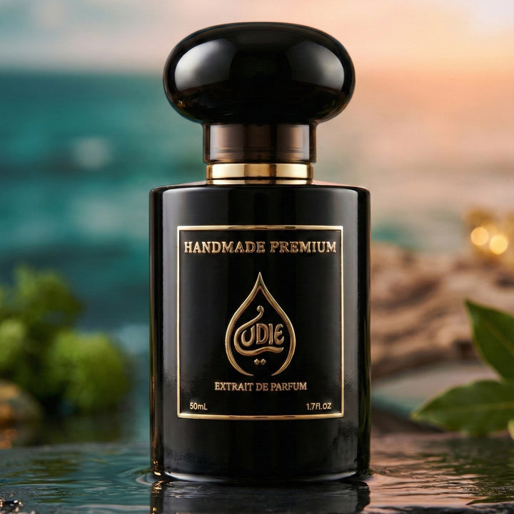 Black perfume bottle with gold accents on a reflective surface, blurred natural background